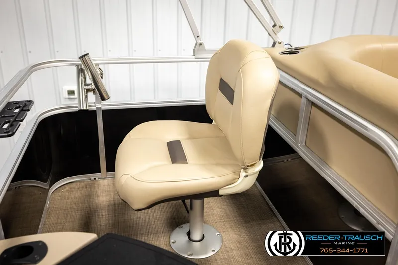 Slide: The Image of 2022 SUNTRACKER BASS BUGGY 18 DLX boat interior with beige seating and railing. - 25