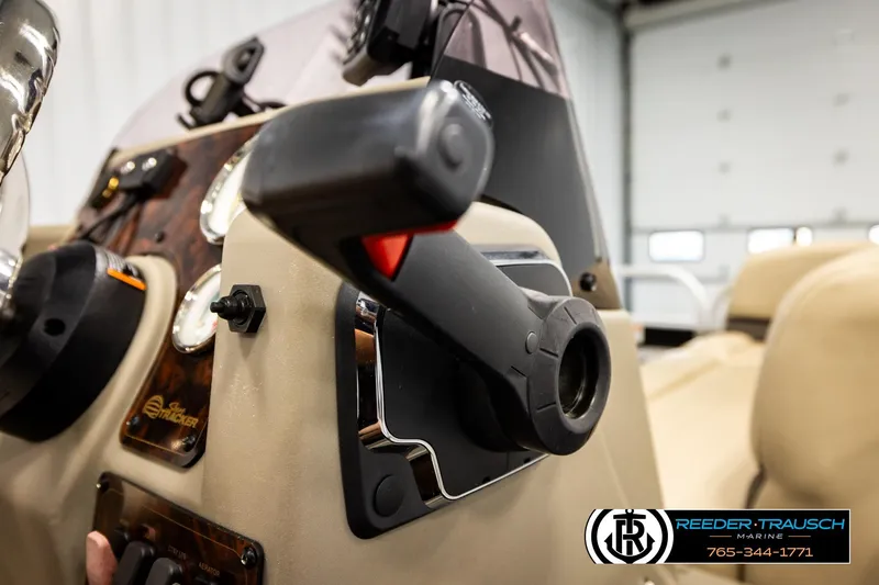 Slide: The Image of Close-up of 2022 SUNTRACKER BASS BUGGY 18 DLX boat dashboard controls. - 32