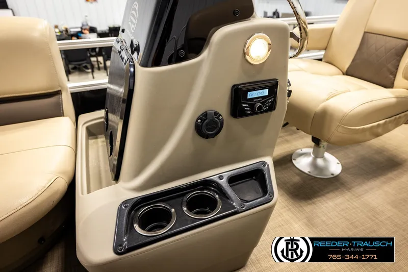 Slide: The Image of Interior of 2022 SUNTRACKER BASS BUGGY 18 DLX boat with beige seating and control panel. - 33