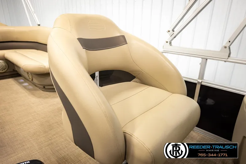 Slide: The Image of 2022 SUNTRACKER BASS BUGGY 18 DLX boat interior with beige seating. - 38