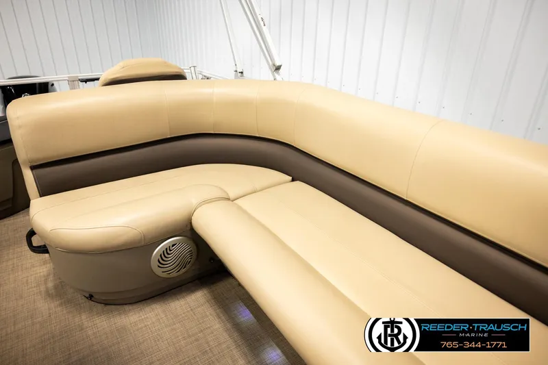 Slide: The Image of 2022 SUNTRACKER BASS BUGGY 18 DLX boat interior with beige and brown seating. - 39