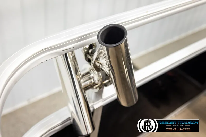 Slide: The Image of Close-up of a 2022 SUNTRACKER BASS BUGGY 18 DLX boat's stainless steel rod holder. - 44