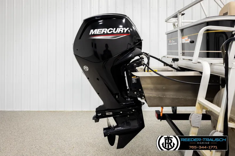 Slide: The Image of 2022 SUNTRACKER BASS BUGGY 18 DLX with Mercury outboard motor in showroom. - 49