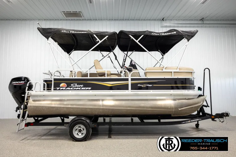 Slide: The Image of 2022 SUNTRACKER BASS BUGGY 18 DLX pontoon boat with Mercury engine in showroom. - 5