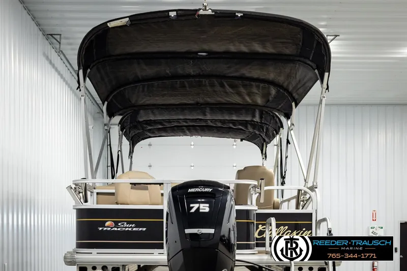 Slide: The Image of 2022 SUNTRACKER BASS BUGGY 18 DLX pontoon boat with Mercury 75 engine in showroom. - 7