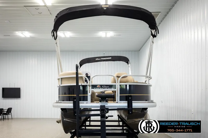Slide: The Image of 2022 SUNTRACKER BASS BUGGY 18 DLX pontoon boat in indoor showroom. - 8