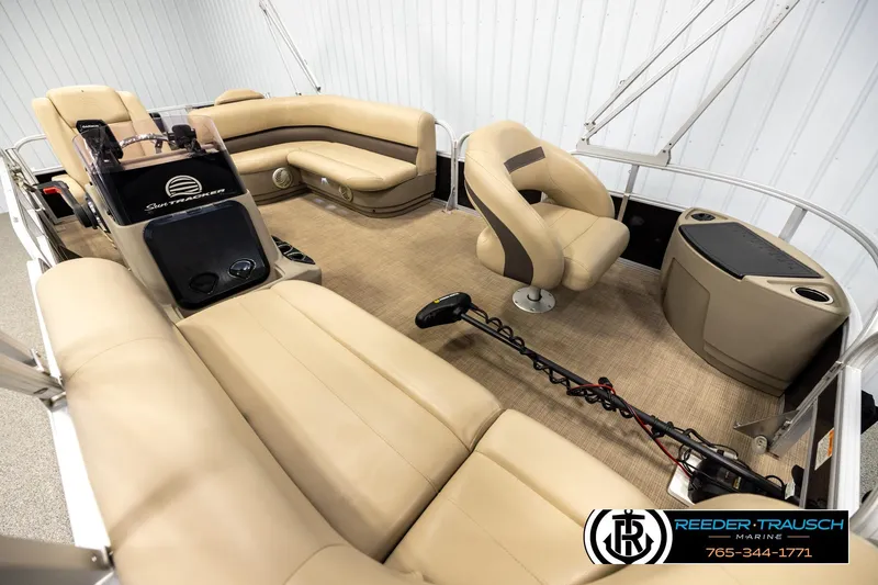 Slide: The Image of 2022 SUNTRACKER BASS BUGGY 18 DLX pontoon boat interior with beige seating and console. - 9