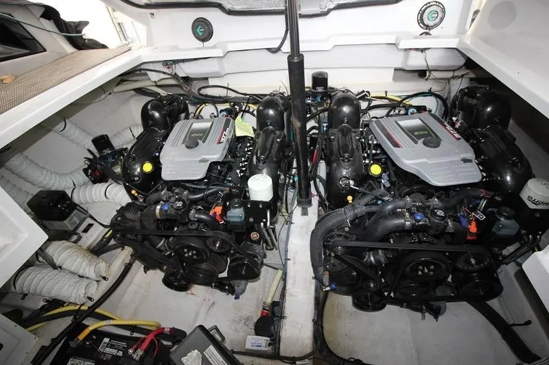 Slide: The Image of Engine compartment of 2015 Cruisers Sport Series 328 Bow Rider with dual engines. - 15