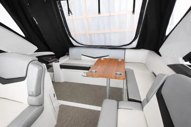 Slide: The Image of Interior of 2015 Cruisers Sport Series 328 Bow Rider with seating and table. - 2