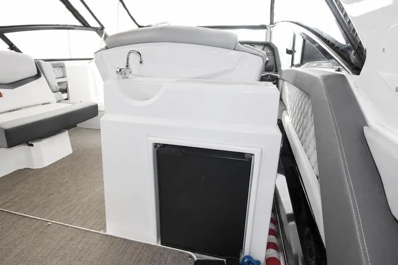 Slide: The Image of Interior of 2015 Cruisers Sport Series 328 Bow Rider with seating and kitchenette. - 3