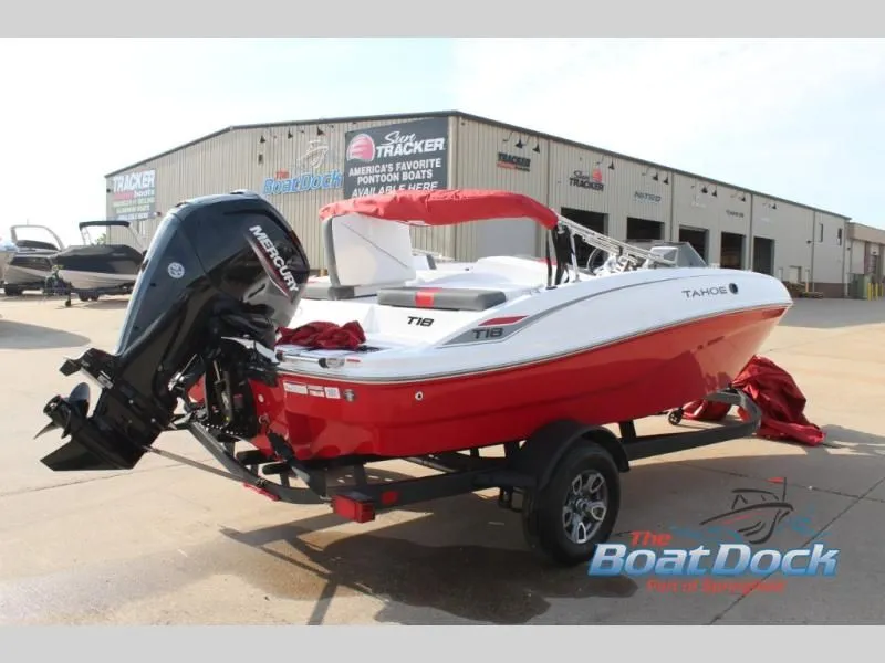 Slide: The Image of Red T-Yachts 18 boat from 2026 on trailer in front of warehouse. - 9