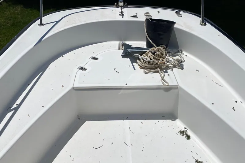 Slide: The Image of 2004 Boston Whaler 170 Montauk boat interior with anchor and rope. - 10