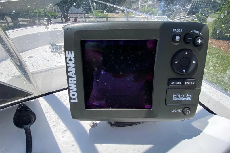 Slide: The Image of Lowrance Elite-5 CHIRP fishfinder on 2004 Boston Whaler 170 Montauk boat dashboard. - 6