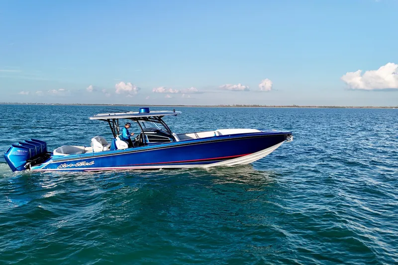 Slide: The Image of 2026 Nor-Tech 390 Sport Center Console boat cruising on open water. - 17