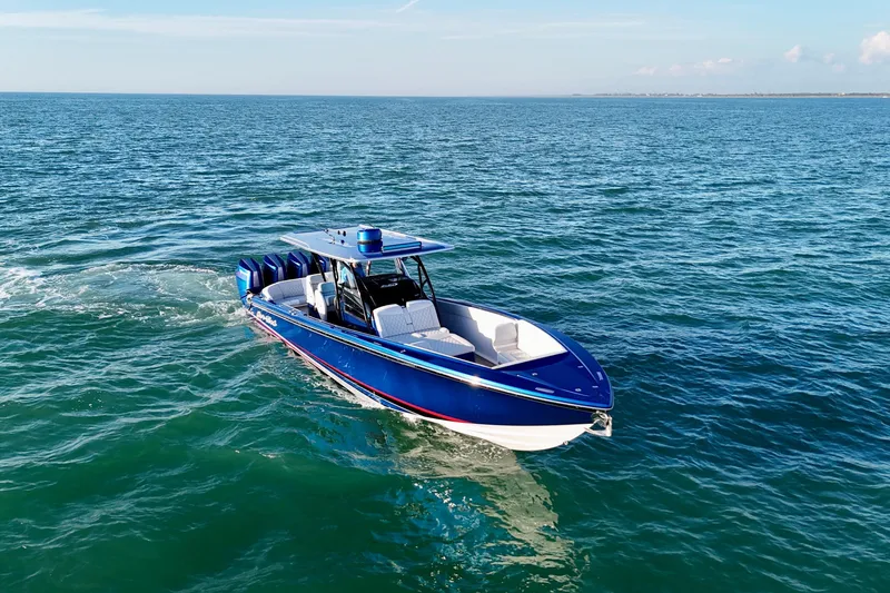 Slide: The Image of 2026 Nor-Tech 390 Sport Center Console cruising on open water. - 19