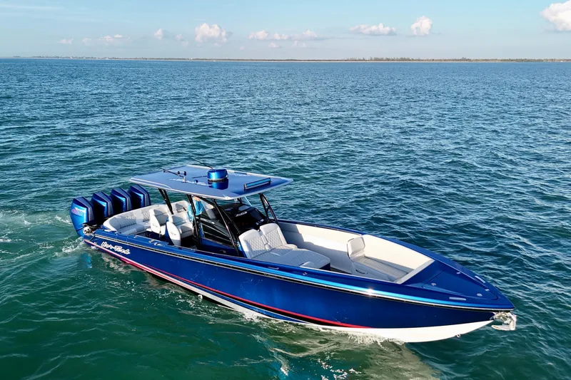 Slide: The Image of 2026 Nor-Tech 390 Sport Center Console boat cruising on open water. - 20