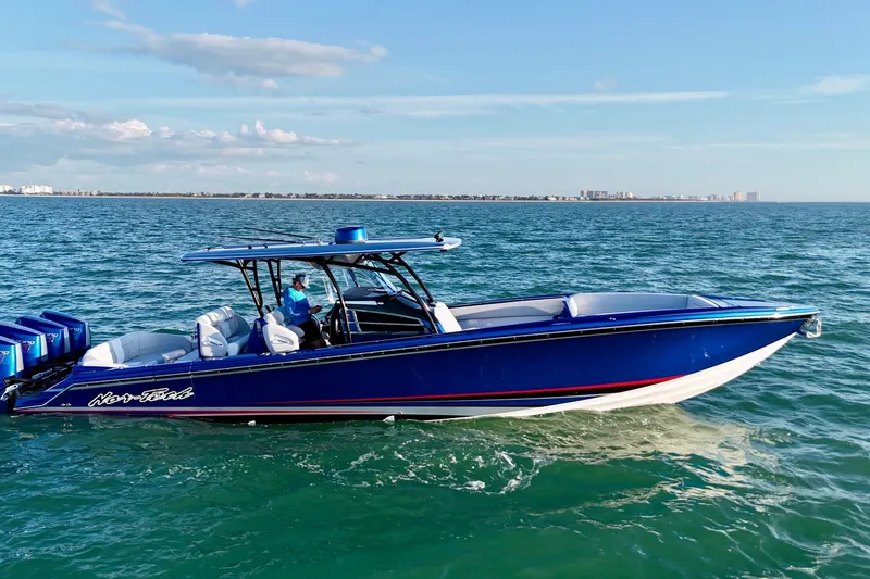 Slide: The Image of 2026 Nor-Tech 390 Sport Center Console boat cruising on open water. - 23