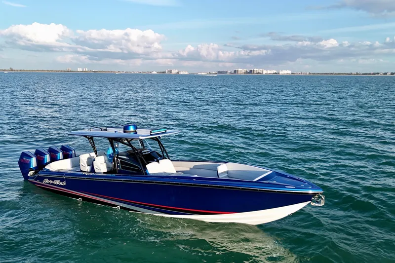 Slide: The Image of 2026 Nor-Tech 390 Sport Center Console boat cruising on open water. - 25