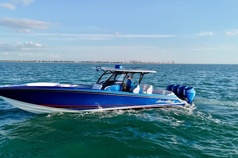Slide: The Image of 2026 Nor-Tech 390 Sport Center Console boat cruising on open water. - 4