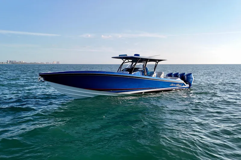 Slide: The Image of 2026 Nor-Tech 390 Sport Center Console boat cruising on open water. - 9