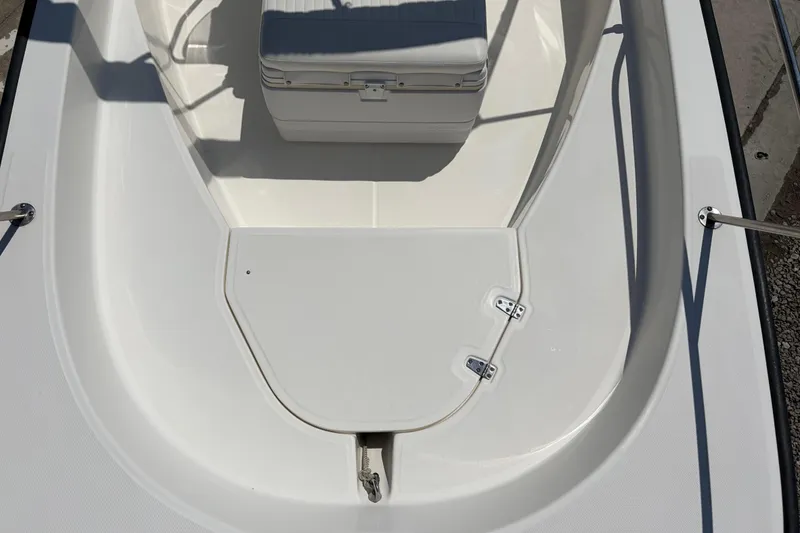 Slide: The Image of 2012 Boston Whaler 170 Montauk boat interior with storage compartment and seating. - 10