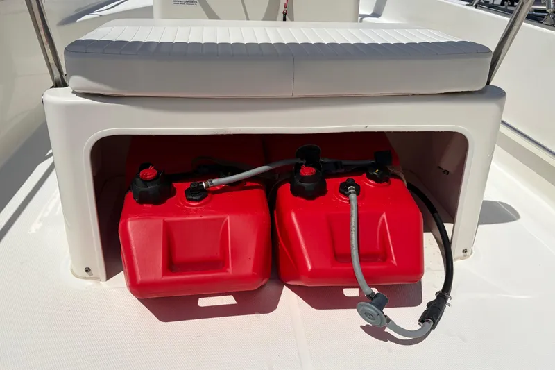 Slide: The Image of 2012 Boston Whaler 170 Montauk boat with red fuel tanks under seat. - 18