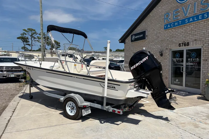 Slide: The Image of 2012 Boston Whaler 170 Montauk boat with Mercury engine at Revis Yacht Sales. - 2