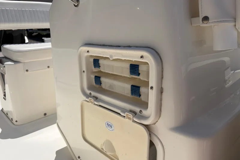 Slide: The Image of 2012 Boston Whaler 170 Montauk boat interior detail with storage compartment. - 21