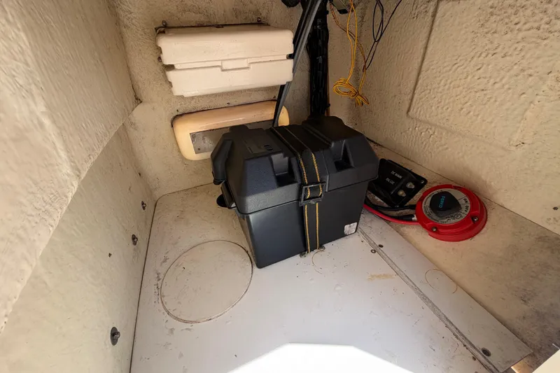 Slide: The Image of Interior of a 2012 Boston Whaler 170 Montauk boat showing battery compartment and wiring. - 22