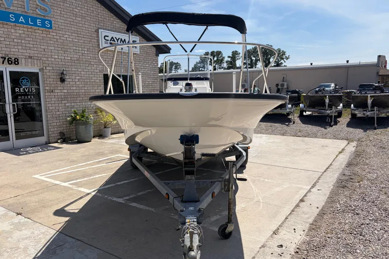 Slide: The Image of 2012 Boston Whaler 170 Montauk boat on trailer outside sales building. - 7