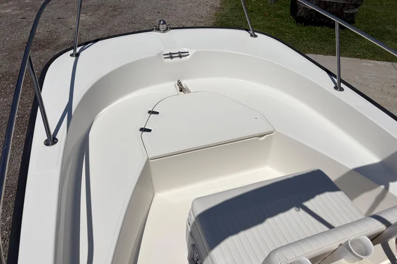 Slide: The Image of 2012 Boston Whaler 170 Montauk boat interior with seating and storage compartment. - 8