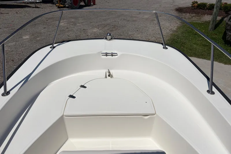 Slide: The Image of 2012 Boston Whaler 170 Montauk boat deck with storage compartment and railing. - 9