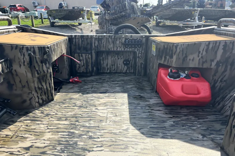 Slide: The Image of Interior of 2026 Excel 1754 Shallow Water F4 Pro Hull boat with camouflage design. - 10