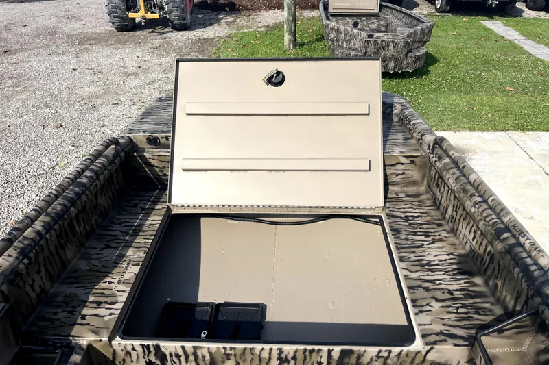 Slide: The Image of 2026 Excel 1754 Shallow Water F4 Pro Hull with open storage compartment, camo design. - 7