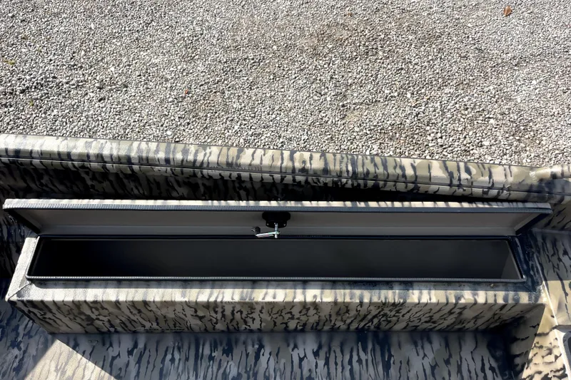 Slide: The Image of 2026 Excel 1754 Shallow Water F4 Pro Hull storage compartment, open on gravel surface. - 9