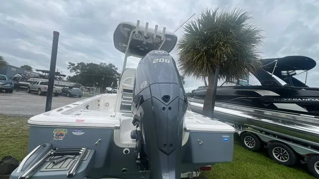 Slide: The Image of 2025 Tidewater 2110 Bay Max boat with outboard motor. - 4