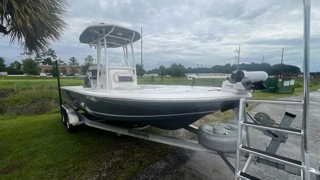 Slide: The Image of 2025 Tidewater 2110 Bay Max boat on trailer, cloudy sky. - 7