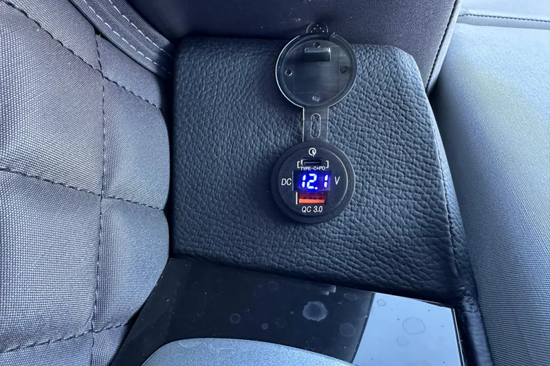 Slide: The Image of Digital voltmeter displaying 12.1 volts on Godfrey AquaPatio 255 SB, 2025 model. - 13