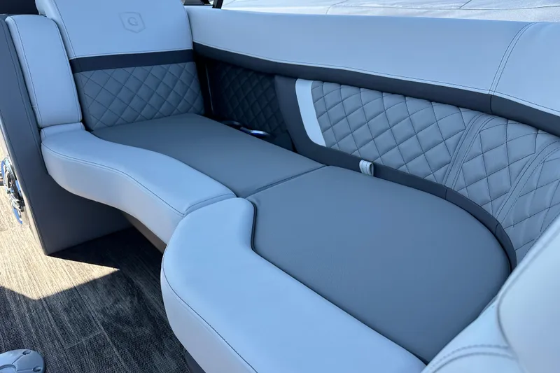 Slide: The Image of Luxurious seating on 2025 Godfrey AquaPatio 255 SB boat, featuring quilted upholstery. - 14