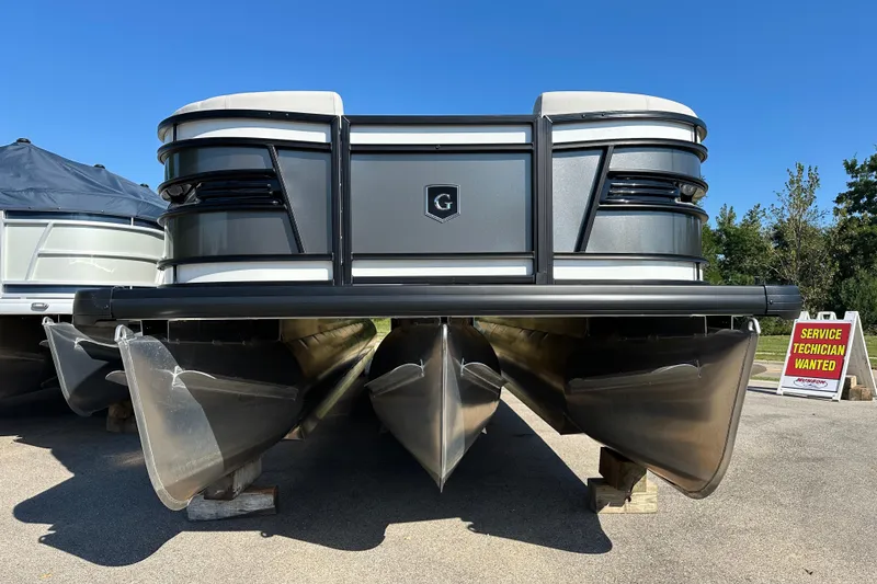Slide: The Image of 2025 Godfrey AquaPatio 255 SB pontoon boat displayed outdoors on a sunny day. - 3