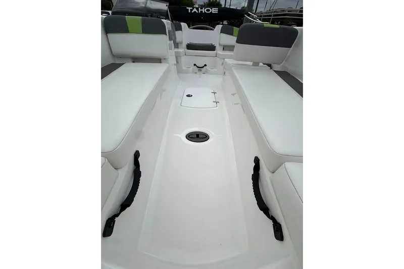 Slide: The Image of 2023 Tahoe T18 boat interior with white seating and green accents. - 3