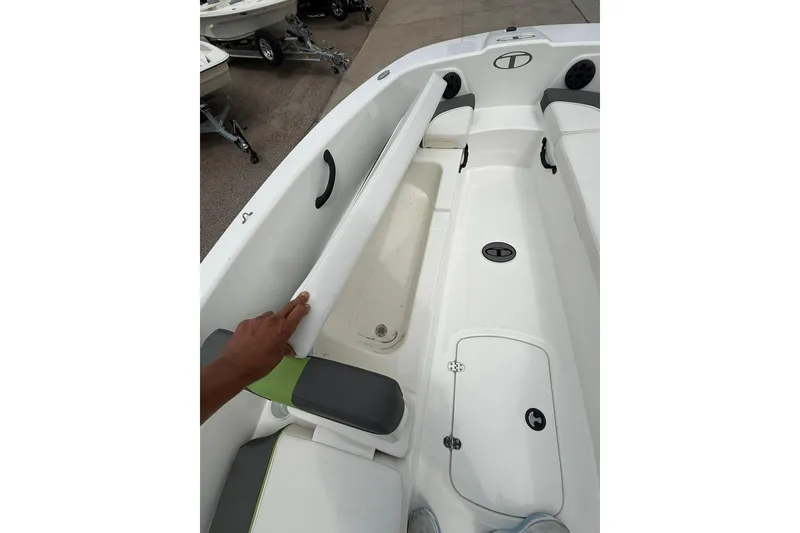 Slide: The Image of 2023 Tahoe T18 boat interior with storage compartment and seating. - 7