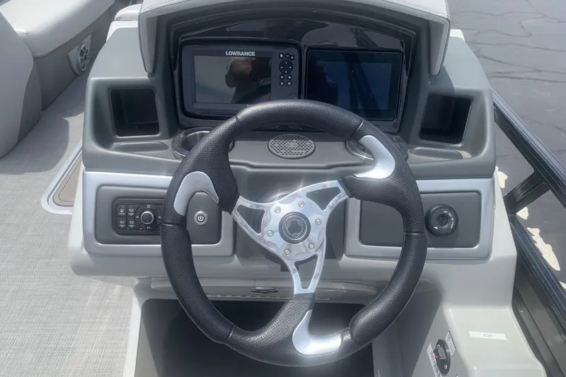 Slide: The Image of Steering console of 2025 Regency 250 DL3 boat with navigation display. - 5