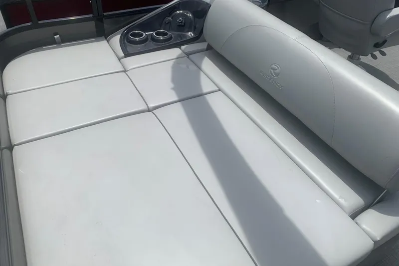 Slide: The Image of Luxurious seating on 2025 Regency 250 DL3 boat with cup holders and sleek design. - 7