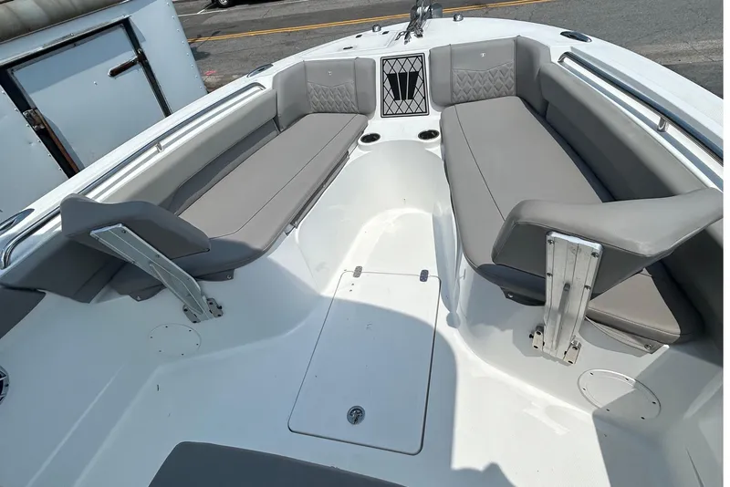 Slide: The Image of 2020 Wellcraft 222 Fisherman boat interior with gray seating and storage compartments. - 7