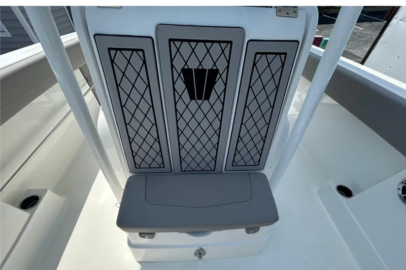 Slide: The Image of 2020 Wellcraft 222 Fisherman boat interior with cushioned seating and storage. - 8