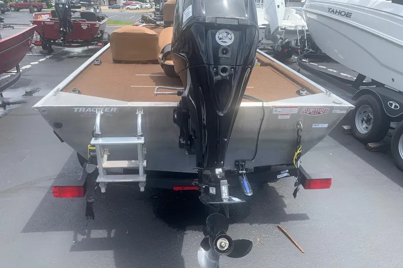 Slide: The Image of 2018 Tracker Bass Tracker 40th Anniversary Heritage Edition boat, rear view with motor and ladder. - 7