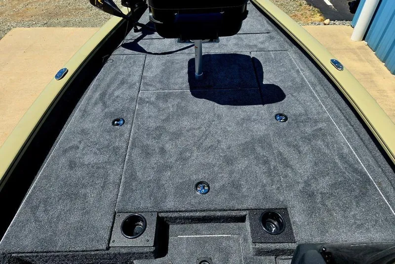 Slide: The Image of 2026 Tracker Pro Team 190 boat deck with gray carpeting and seating. - 18
