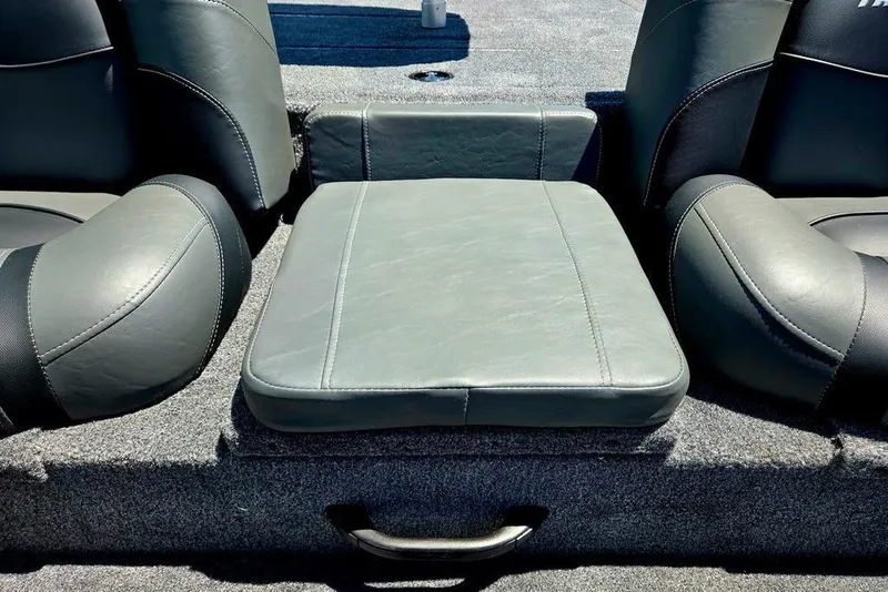 Slide: The Image of 2026 Tracker Pro Team 190 boat seating with gray upholstery and armrests. - 21