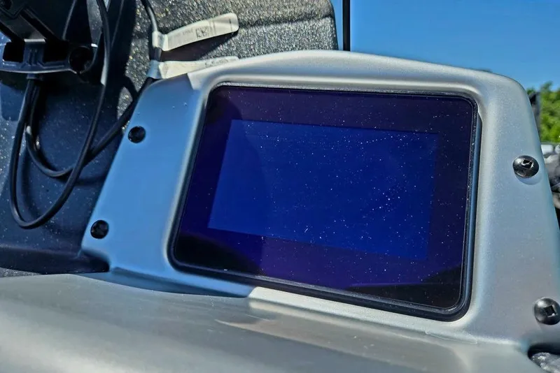 Slide: The Image of Dashboard screen of 2026 Tracker Pro Team 190 boat under clear blue sky. - 26